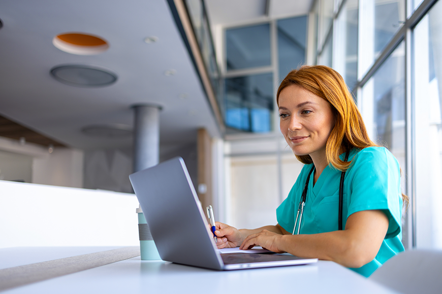 Nurse practitioner working on computer