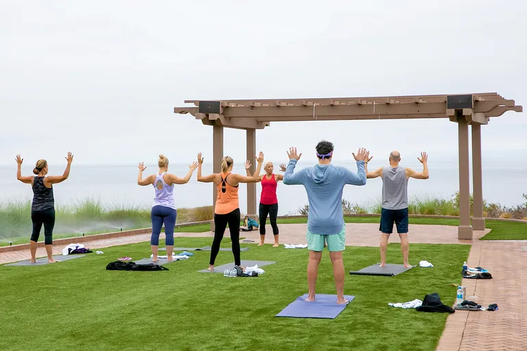 NRF Nexus attendees practicing yoga