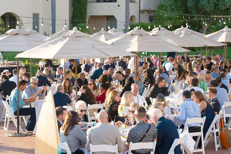 NRF Nexus attendees networking at an outdoor dinner