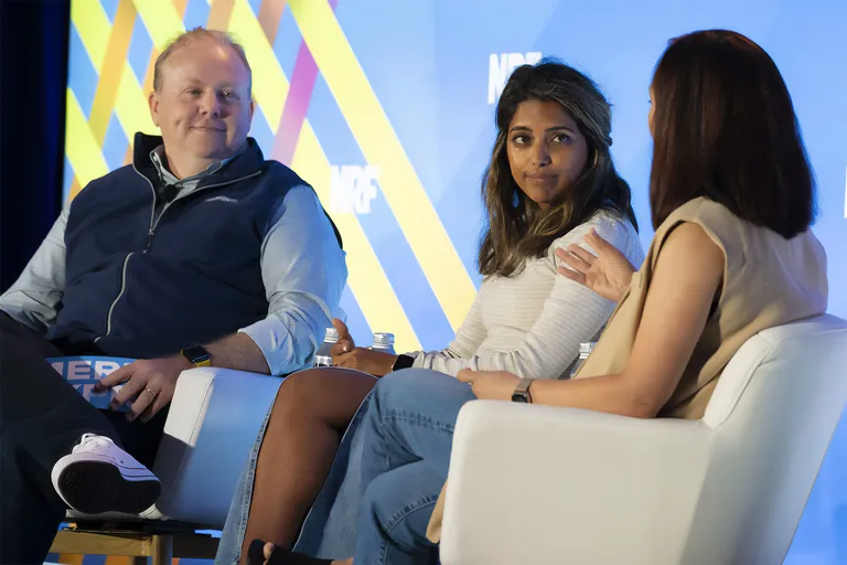 A panel discussion on stage at NRF Nexus