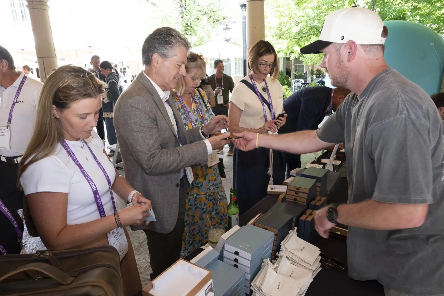 NRF Nexus attendees collect their welcome bags and registration materials.