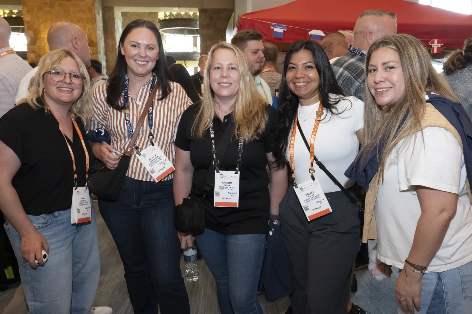 Five women in the loss prevention and secuirty business take a break from networking at NRF PROTECT to post and smile for the camera.