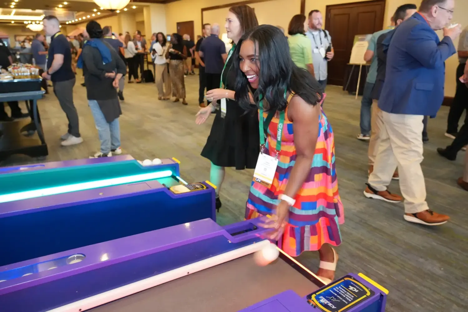 A woman tries to get the top score on a skee-ball machine at the NRF Protect 20205 welcome party.
