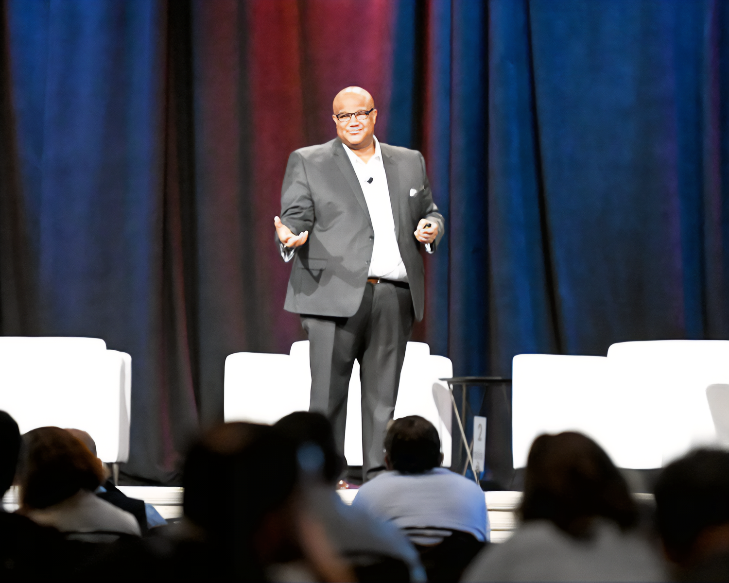 A speaker on stage at NRF Rev