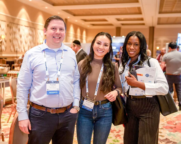 Attendees networking at NRF Rev