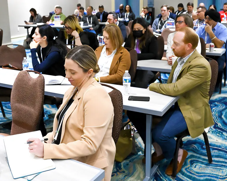 Attendees in a session at NRF Rev