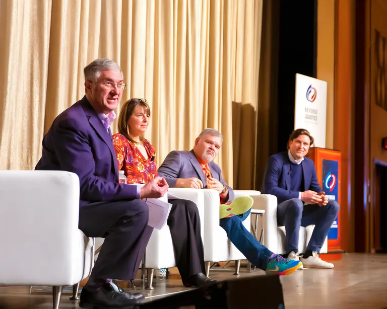 Speakers on stage at NRF Rev