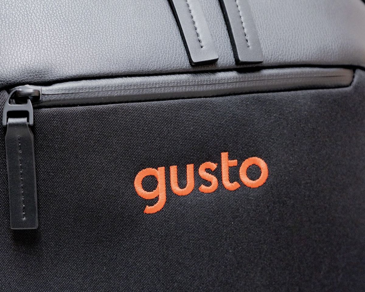 Embroidered logo on a Troubadour bag