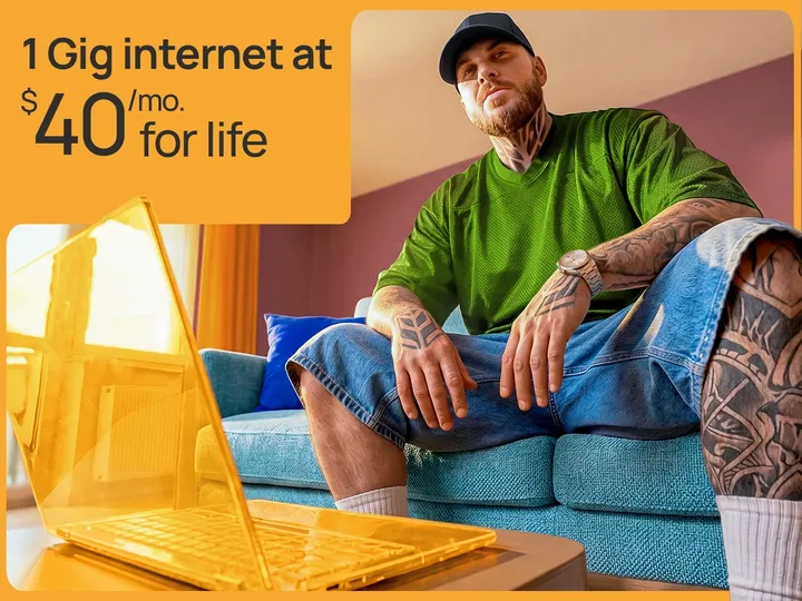 A welo customer sits on a blue couch next to a yellow laptop. Text: 1 Gig internet at $40/month for life.