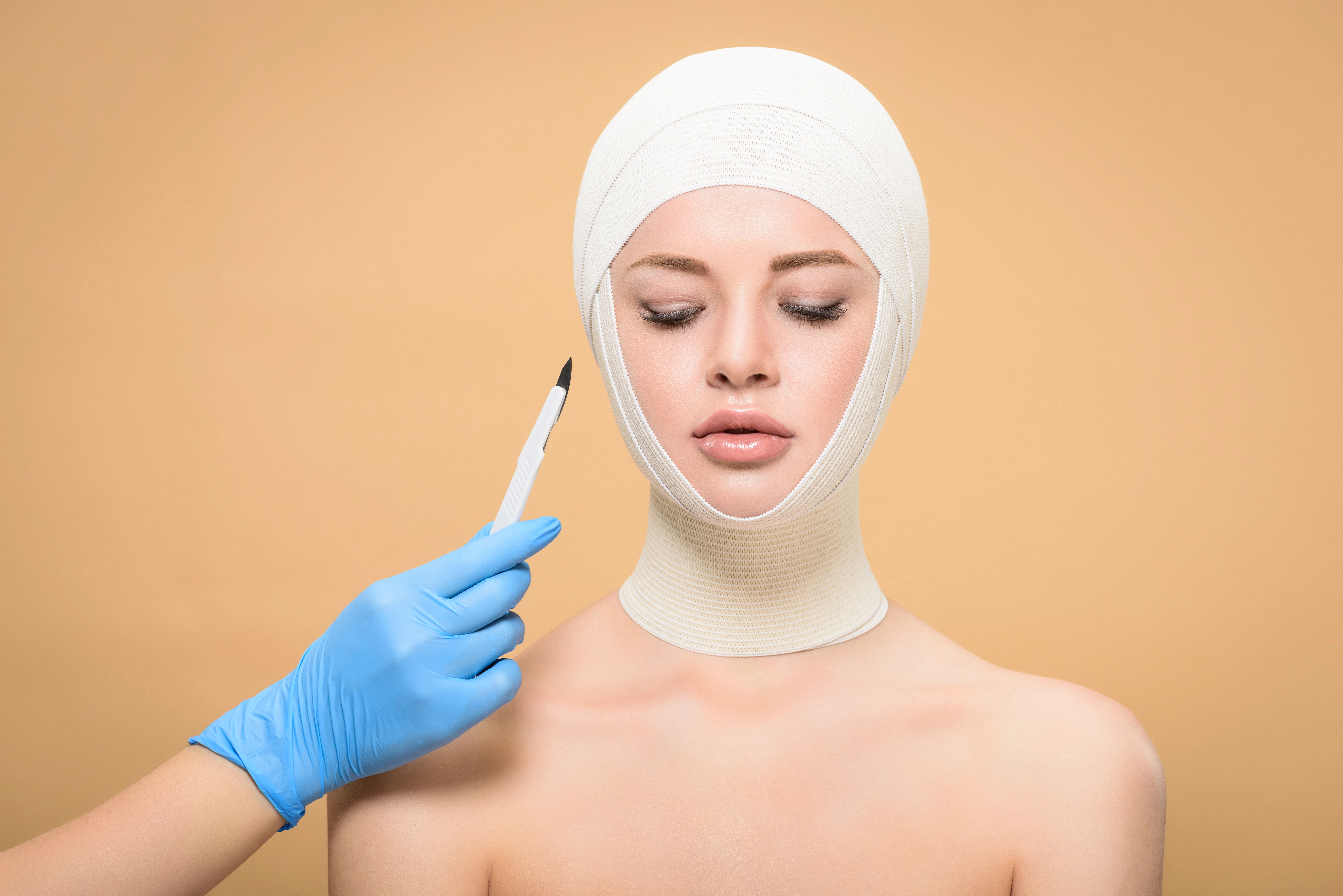 Woman with bandages on face after face lift