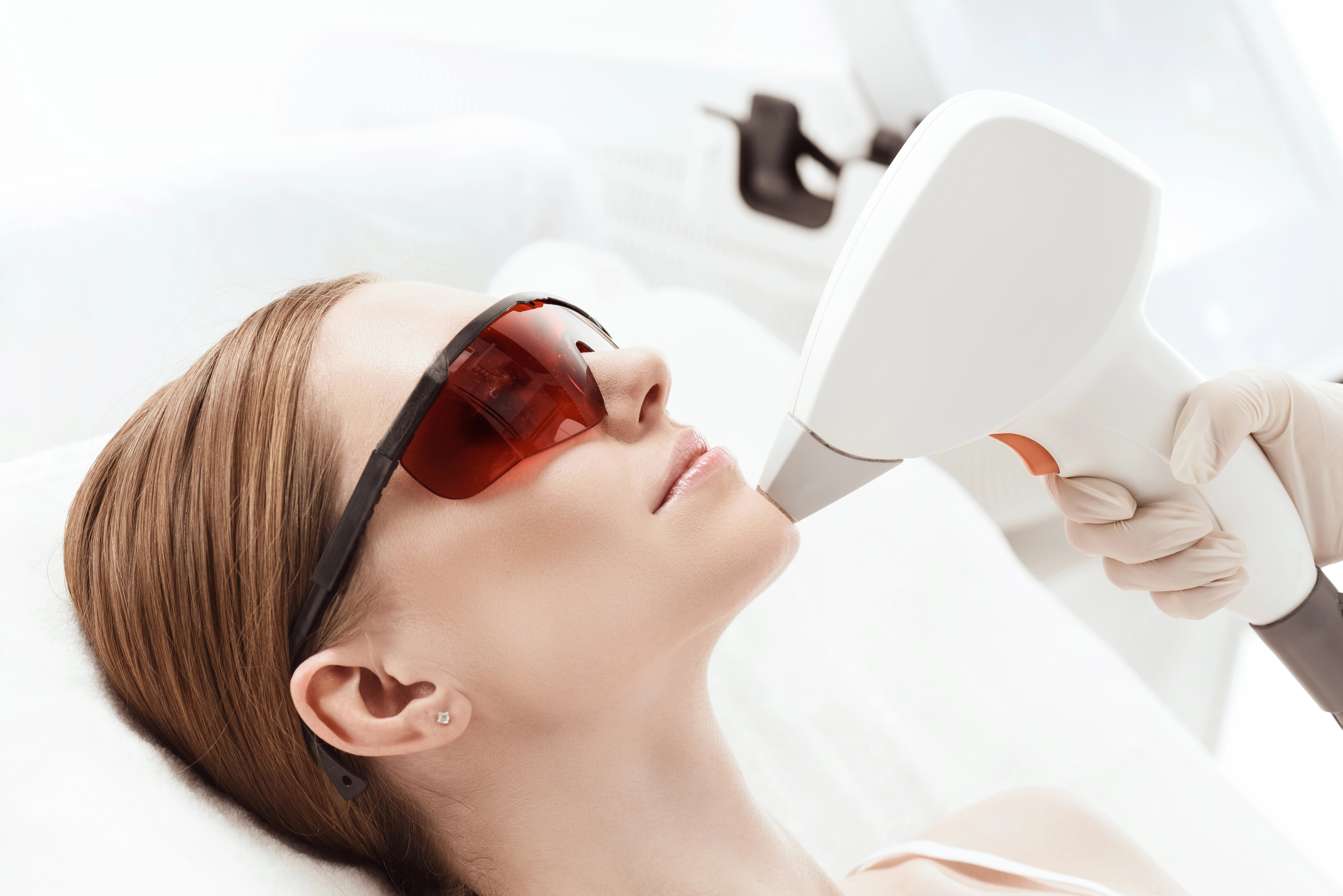women getting laser treatment on face
