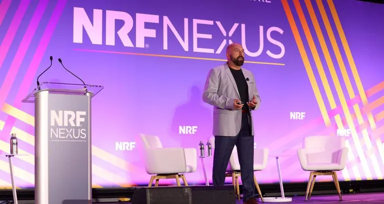 Alex Genov speaking at NRF Nexus 2023.