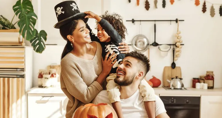 Family decorating for Halloween.