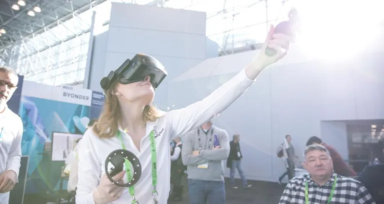 An individual sampling new technology at Retail's Big Show.