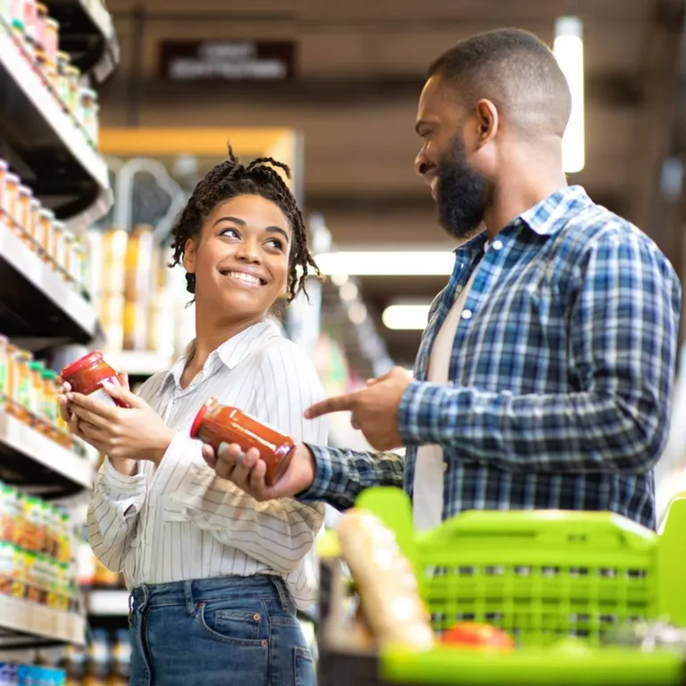 A couple grocery shopping.