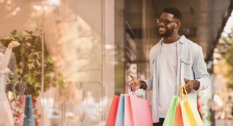 A man window shopping.