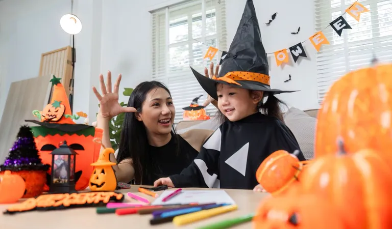 Mother and daughter celebrating Halloween.