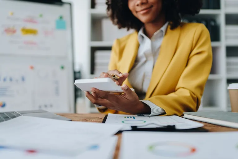 Person using calculator.