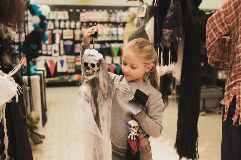 Little girl shopping for decorations.