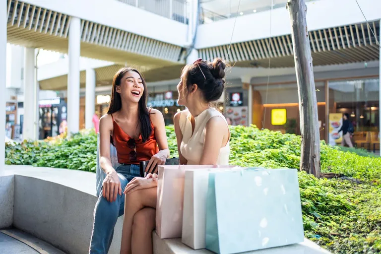 Friends chatting while shopping.