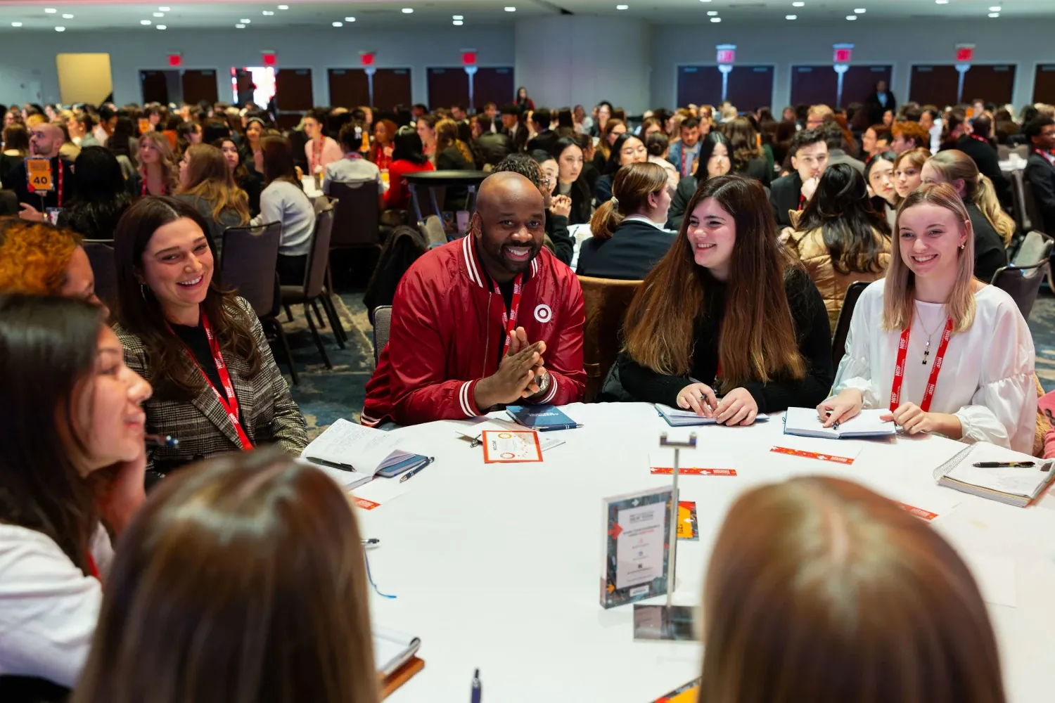 During the Student Program 20205 Executive Mentor Experience, an executive in a Target jacket discusses retail careers at a roundtable.