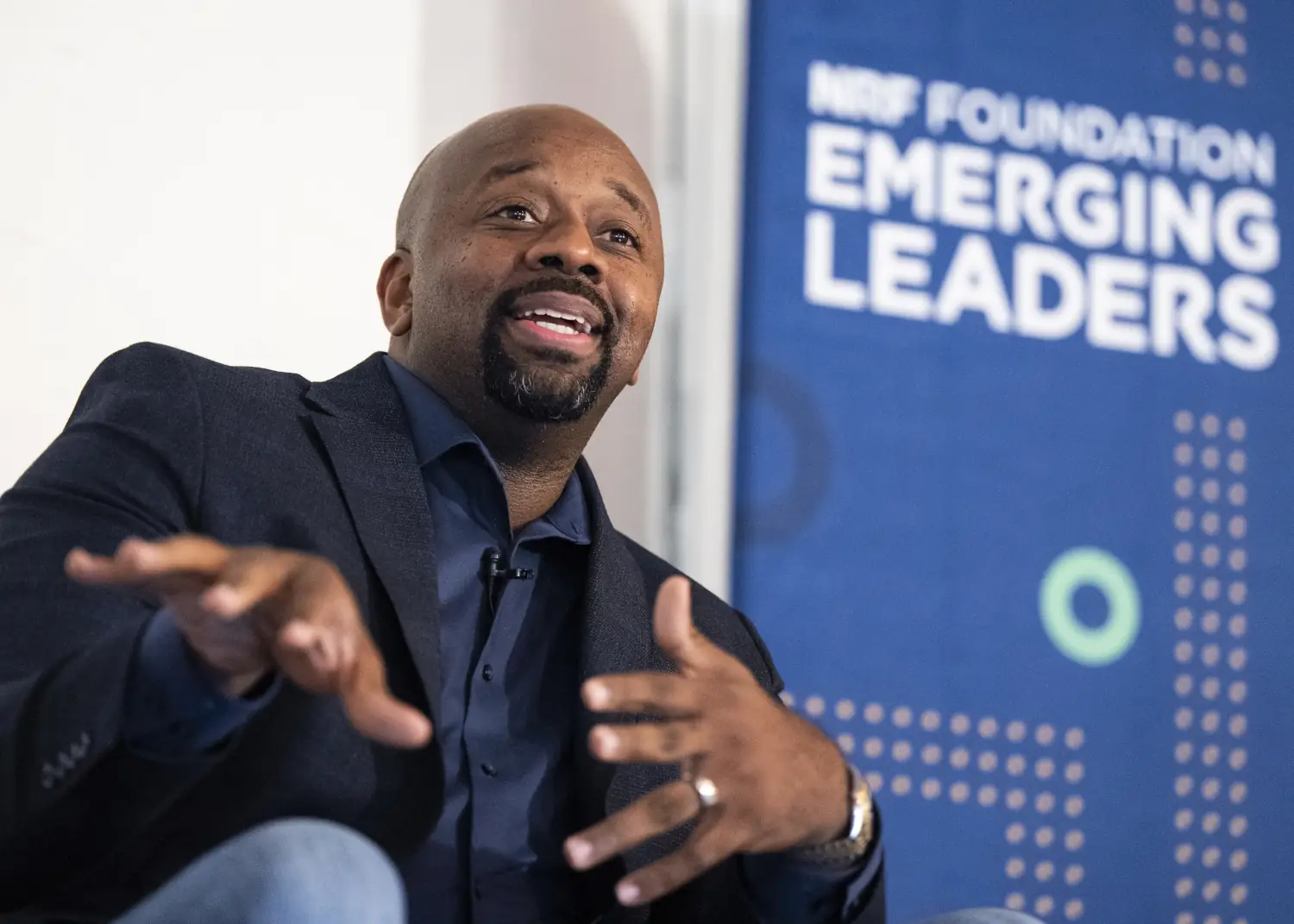 A NRF Foundation Emerging Leaders 2026 Summit panel speaker discusses a topic on stage.