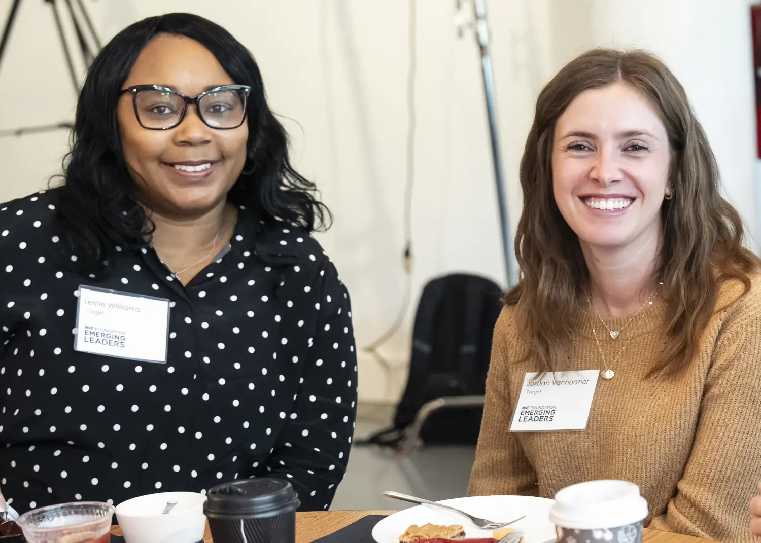 Two NRF Foundation Emerging Leaders 2026 Summit attendees pose for a picture at their roundtable.