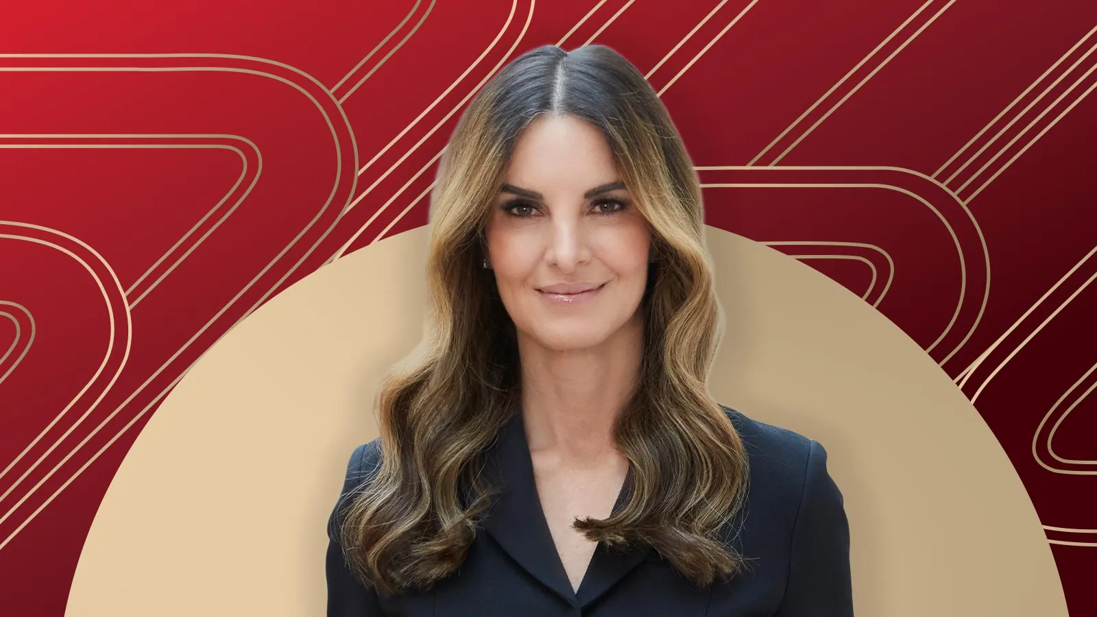 Member of "The List", Amiee Bayer-Thomas, stands against a red and beige geometric background.