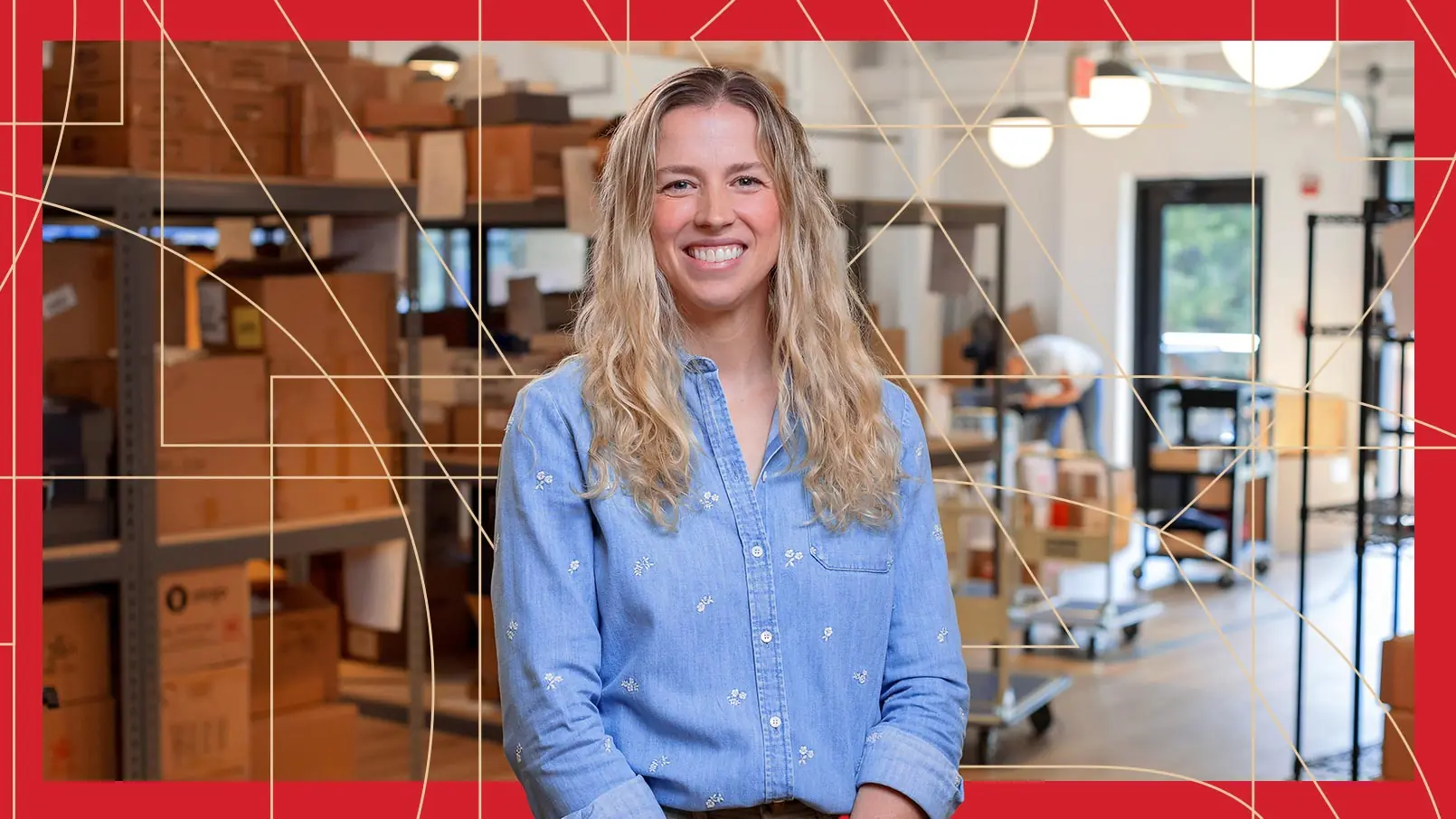 Founder & CEO of Teak & Twine, Torrance Hart, poses in front of her store inventory. The photo has a red border and thin, gold, and geometric lines running through the background.