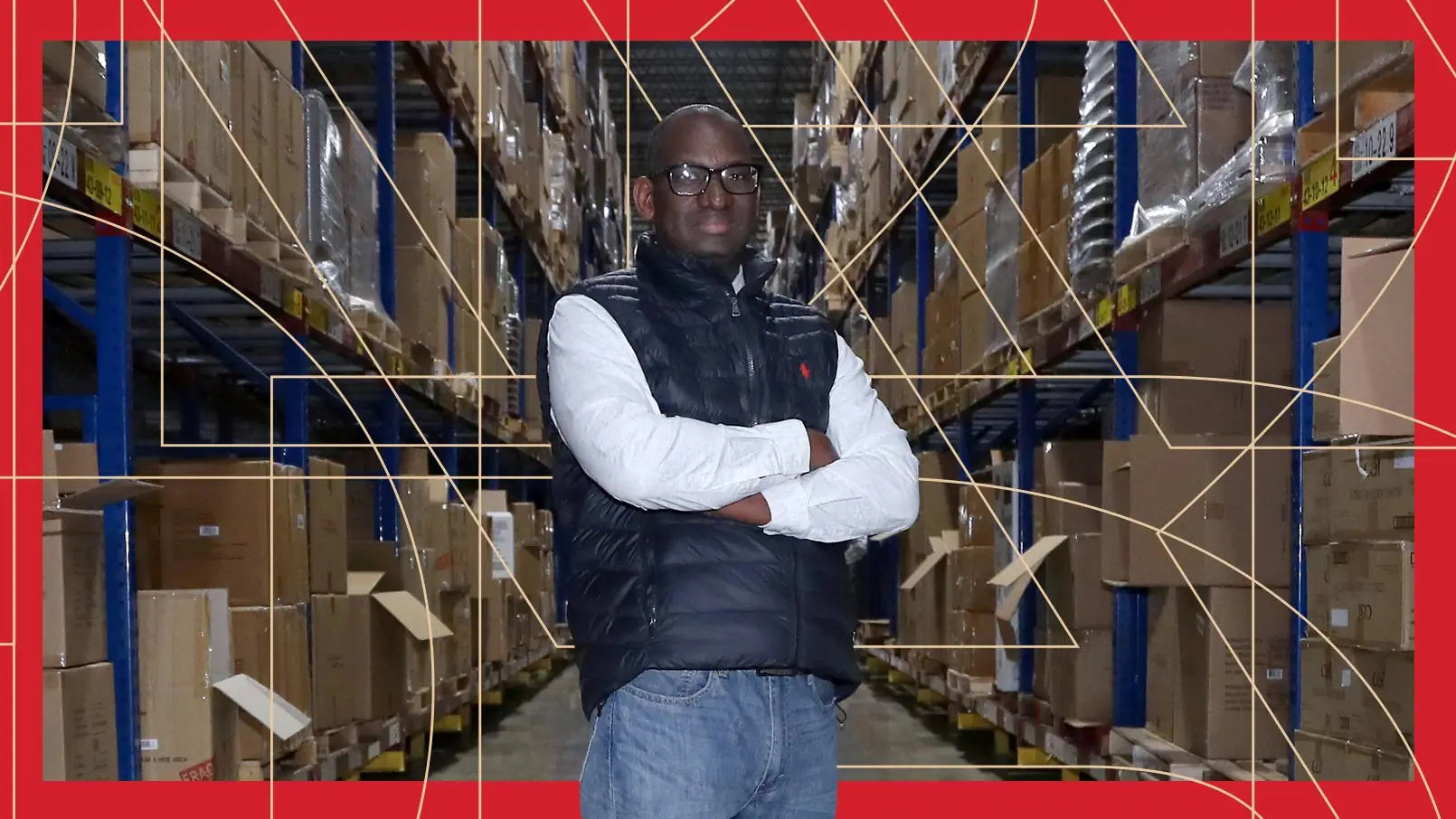 Distribution Center Services Manager Senyi Gueye poses with his arms crossed in the PetSmart warehouse. The photo has a red border and thin, gold, and geometric lines running through the background.