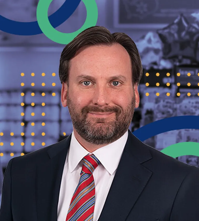 Professional bio photo of Jason Straczewski overlayed upon the NRF Emerging Leaders brand colors of blue and green.