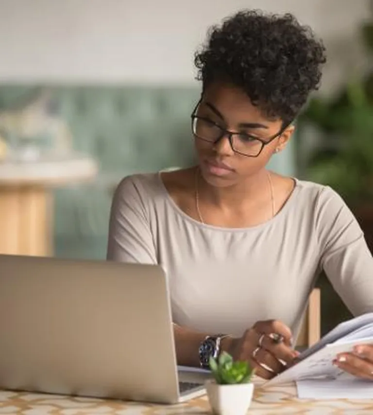 Woman working on her laptop.