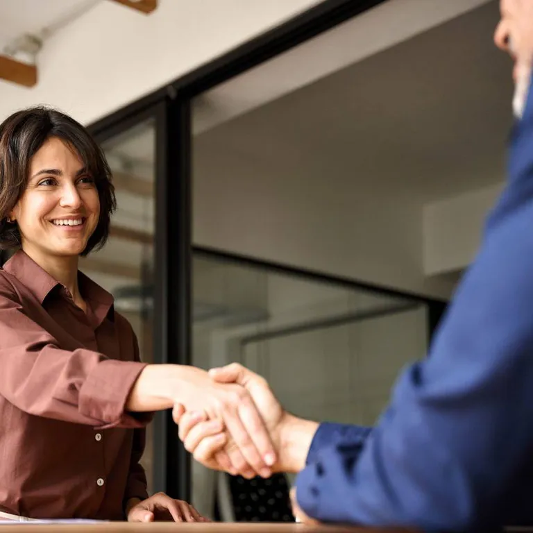 Woman shaking hands.