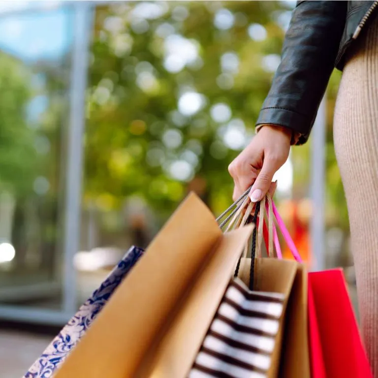 A woman holding bags.