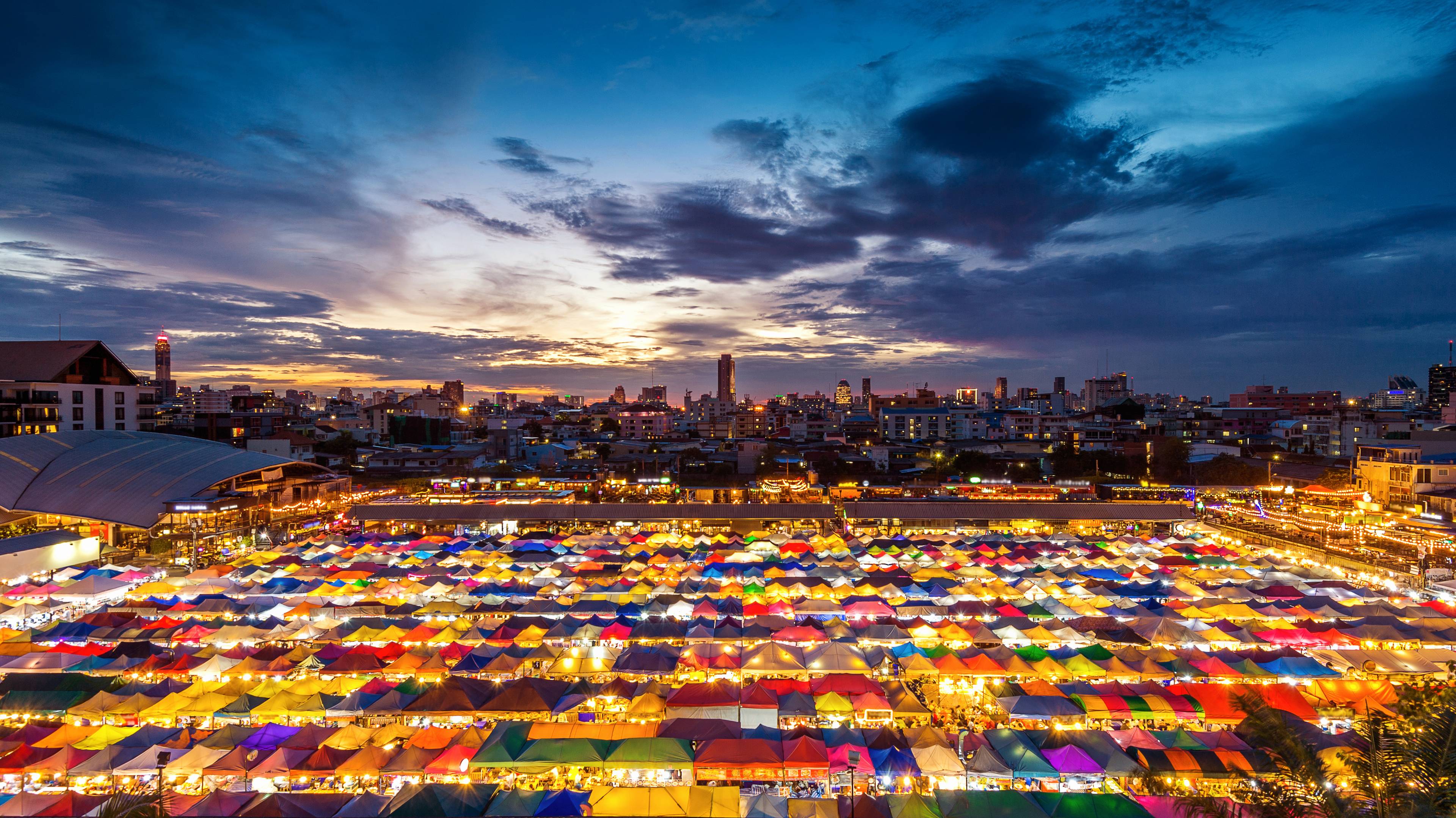 https://a-us.storyblok.com/f/1021279/4928x2772/71f8b91e9b/colorful-tents-bangkok.jpg/m/3840x2160/filters%3Aquality%2870%29?utm_source=chatgpt.com