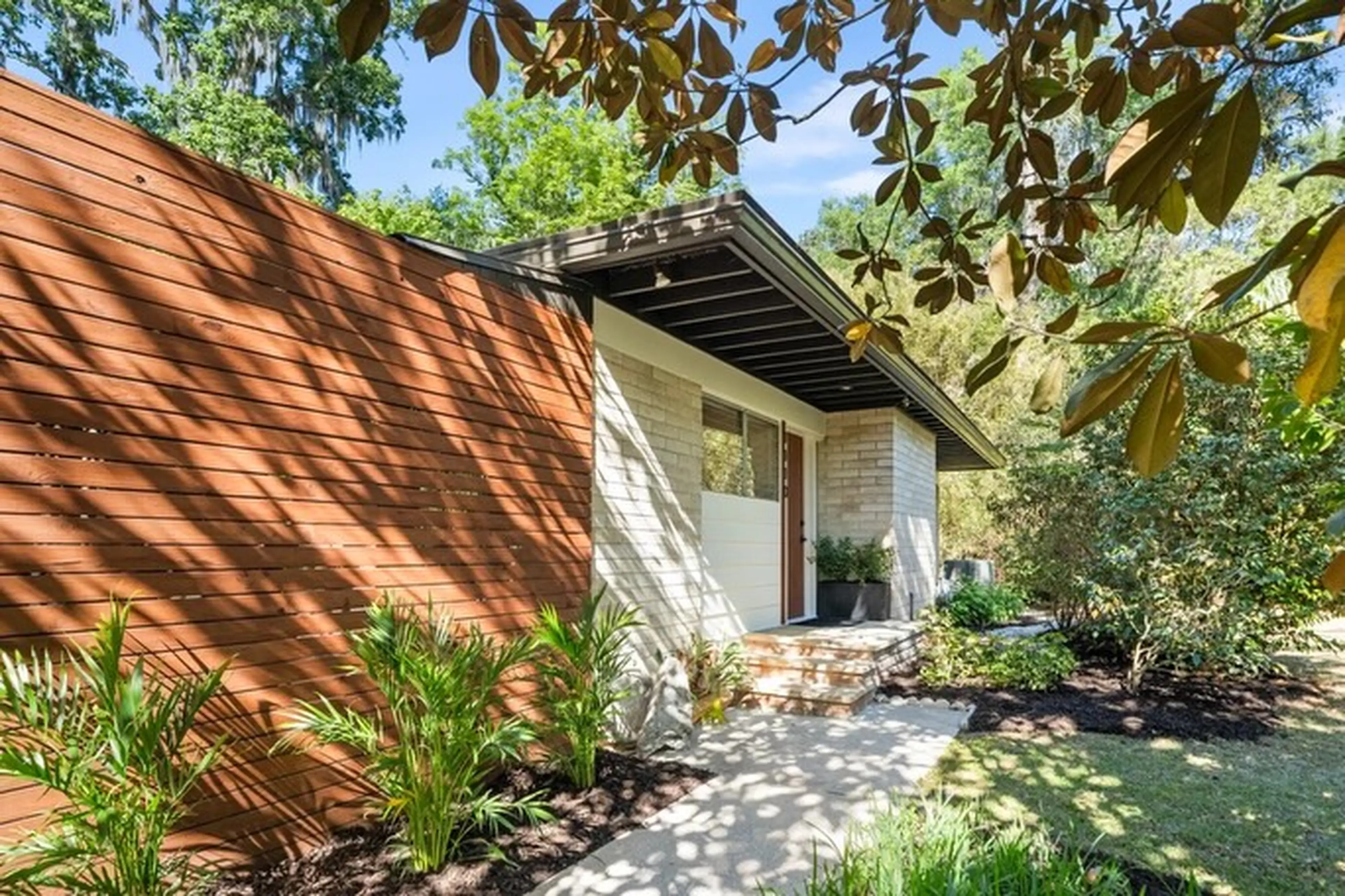 Outside home with wood paneling