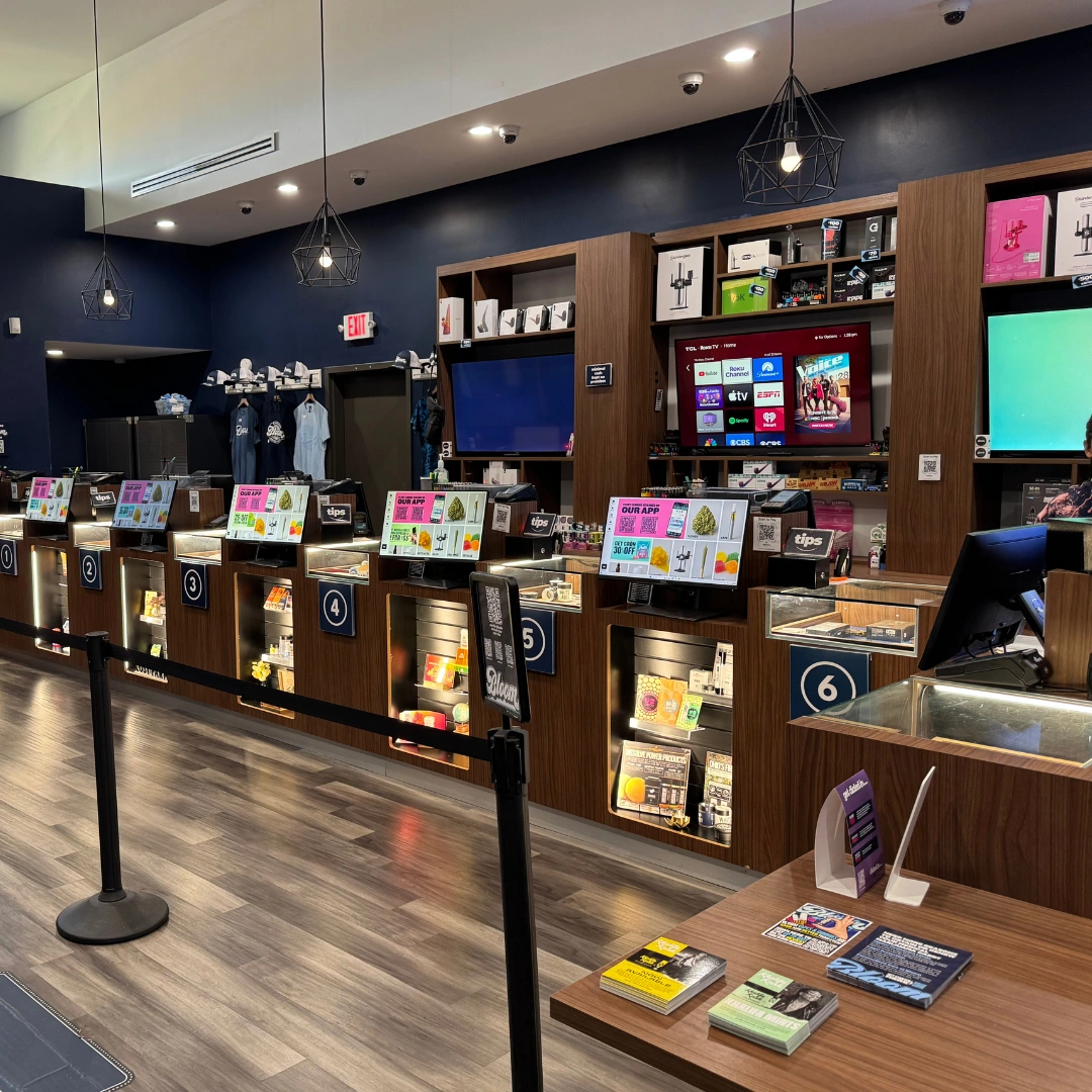 Bloom marijuana Seven Mile dispensary accessory wall behind counters with grinders, vaporizers, rolling papers and more on shelf