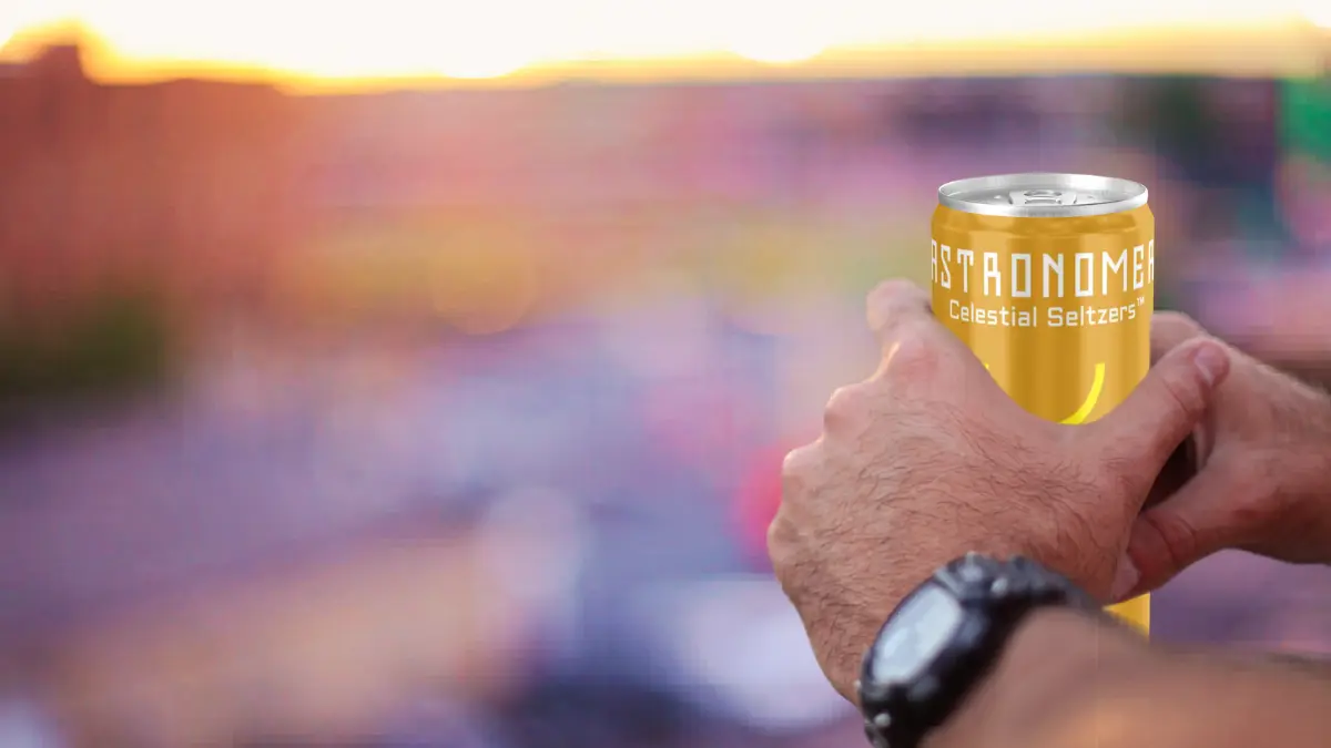 man holding a chilled THC seltzer can