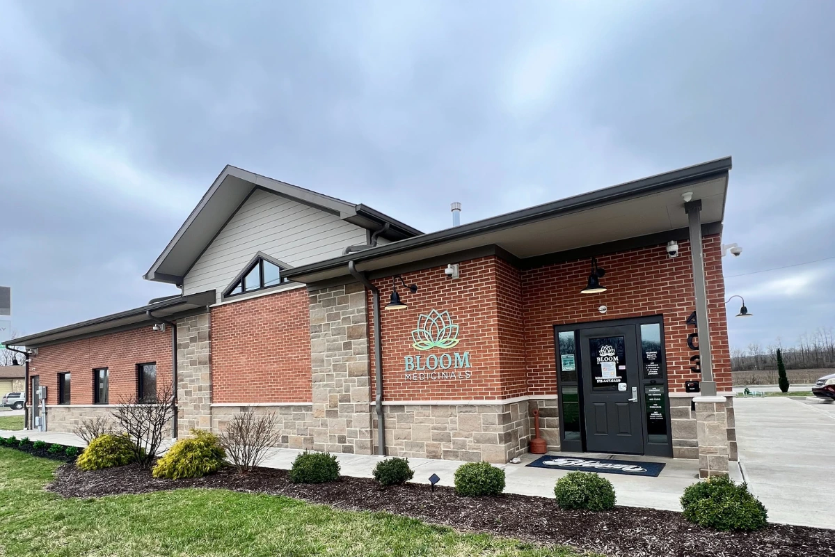 Bloom Seven Mile dispensary storefront exterior with brick and stone design and main entrance.