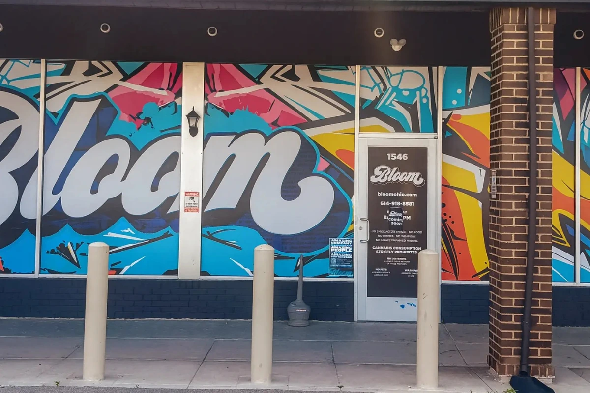 Bloom Cannabis South Columbus dispensary storefront featuring colorful mural art and branded entrance signage.