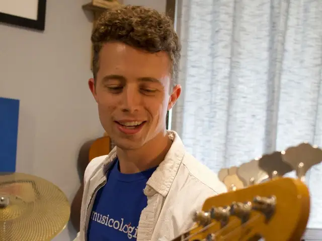 Bass Teacher Practicing While Smiling