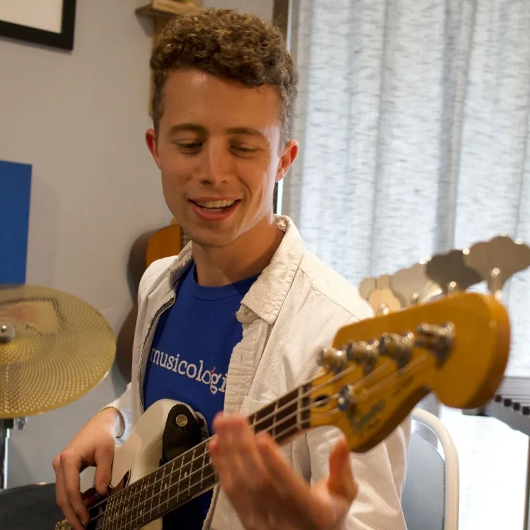 Bass Teacher Practicing While Smiling