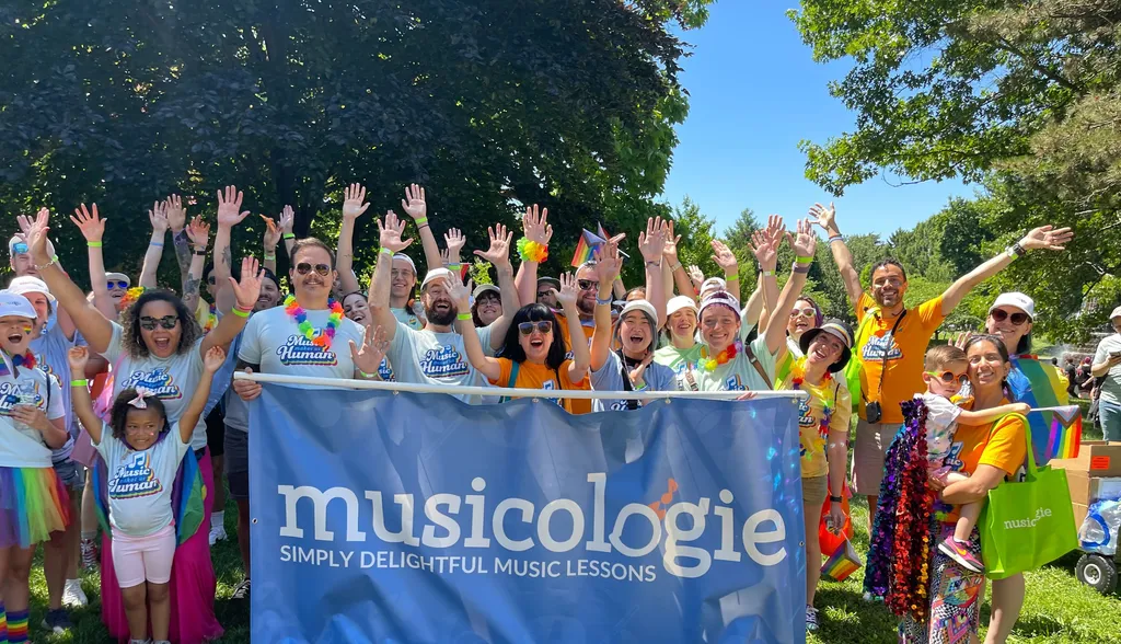Musicologie Group with Hands in the air with Banner