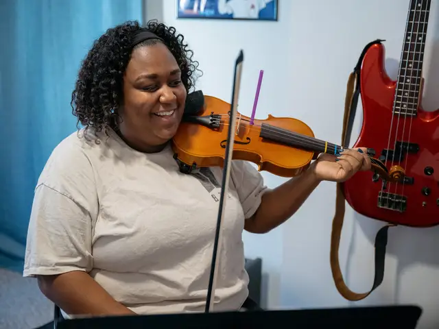 Violin Student smiling and playing in a lesson