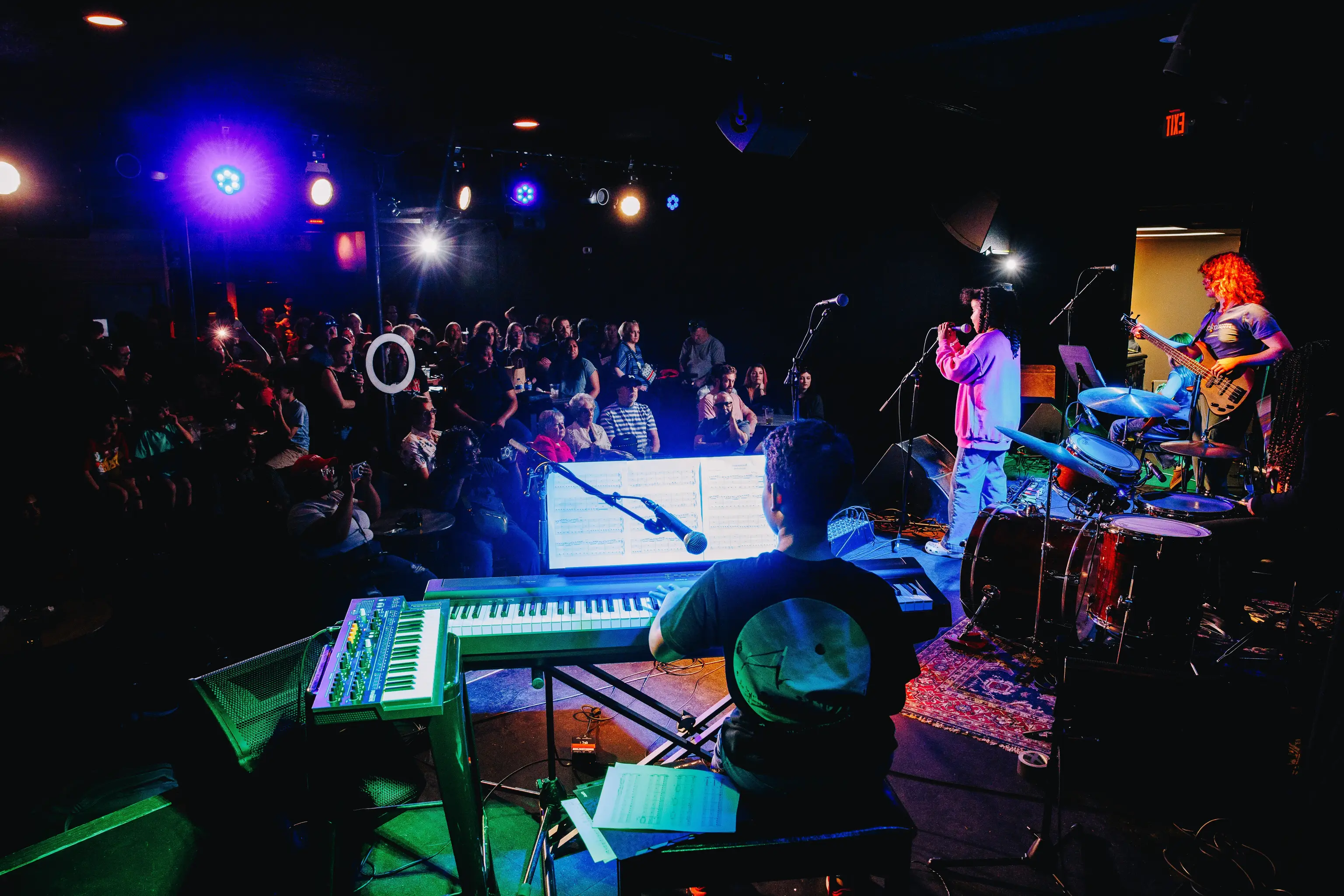 A Musicologie RockStars band performs at free concert.