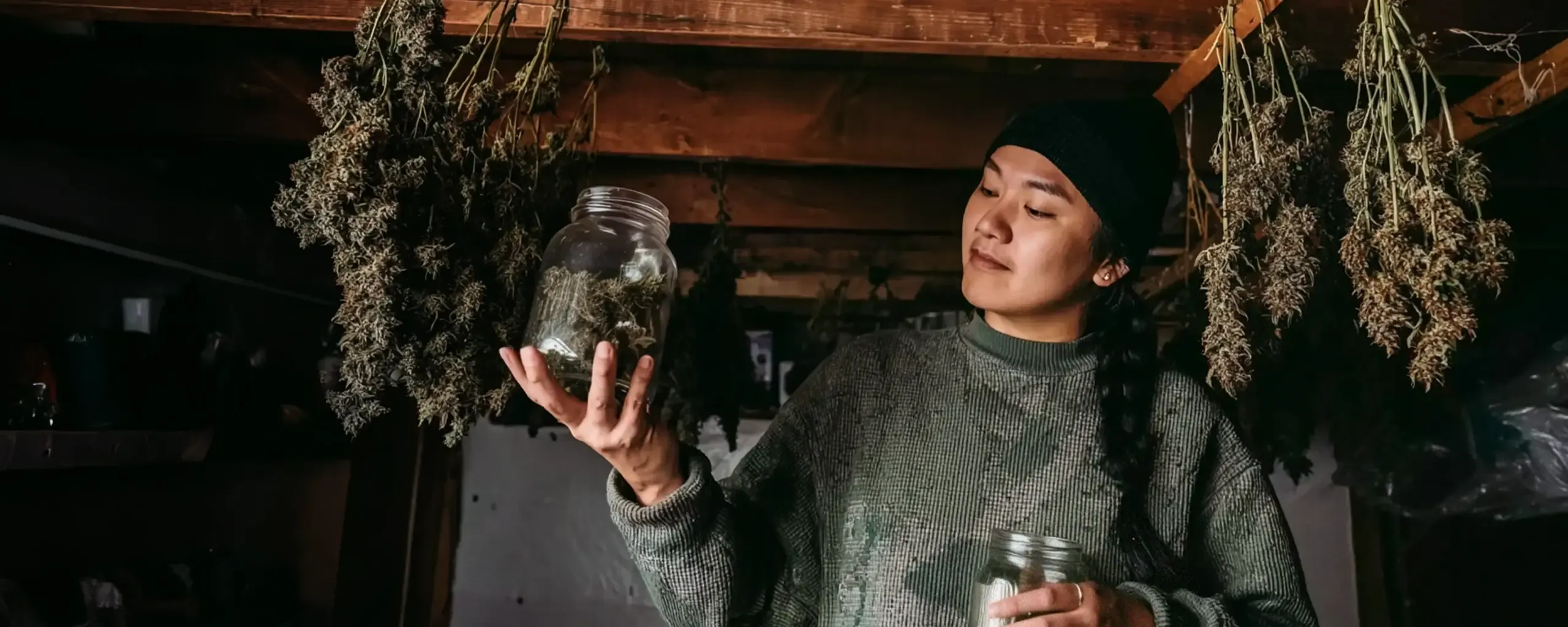 Girl Holding Jar of Cannabis Buds