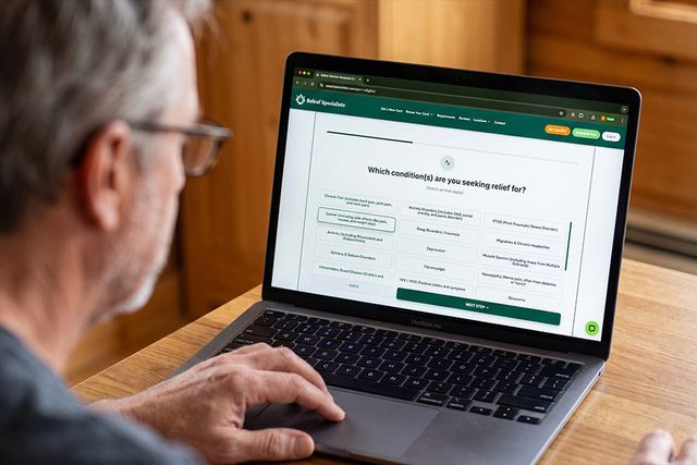 A quick and easy medical cannabis card application with Releaf Specialists. Someone using his laptop to apply for a medical cannabis card through Releaf Specialists, a top choice for fast and easy applications across several states.