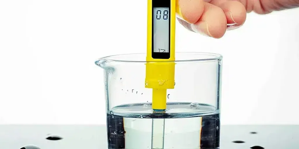 A pH meter inserted into a container of water, displaying the pH level to help growers monitor the water's pH balance, ensuring it is within the ideal range for cannabis cultivation.