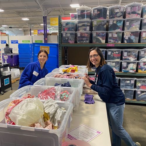 RSI volunteers in warehouse for Cradles to Crayons