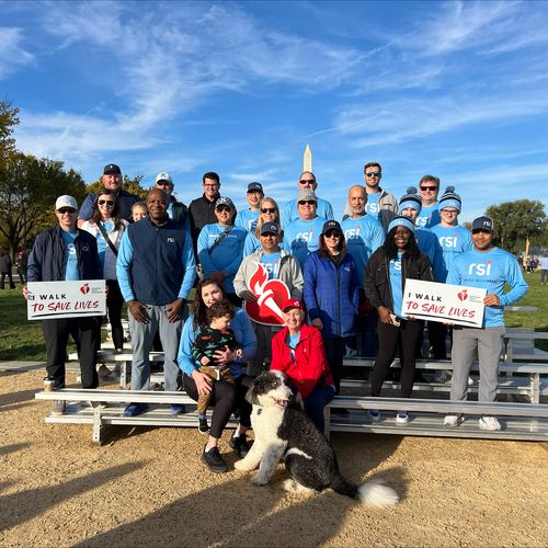 Company group photo outdoors after walking for a cause